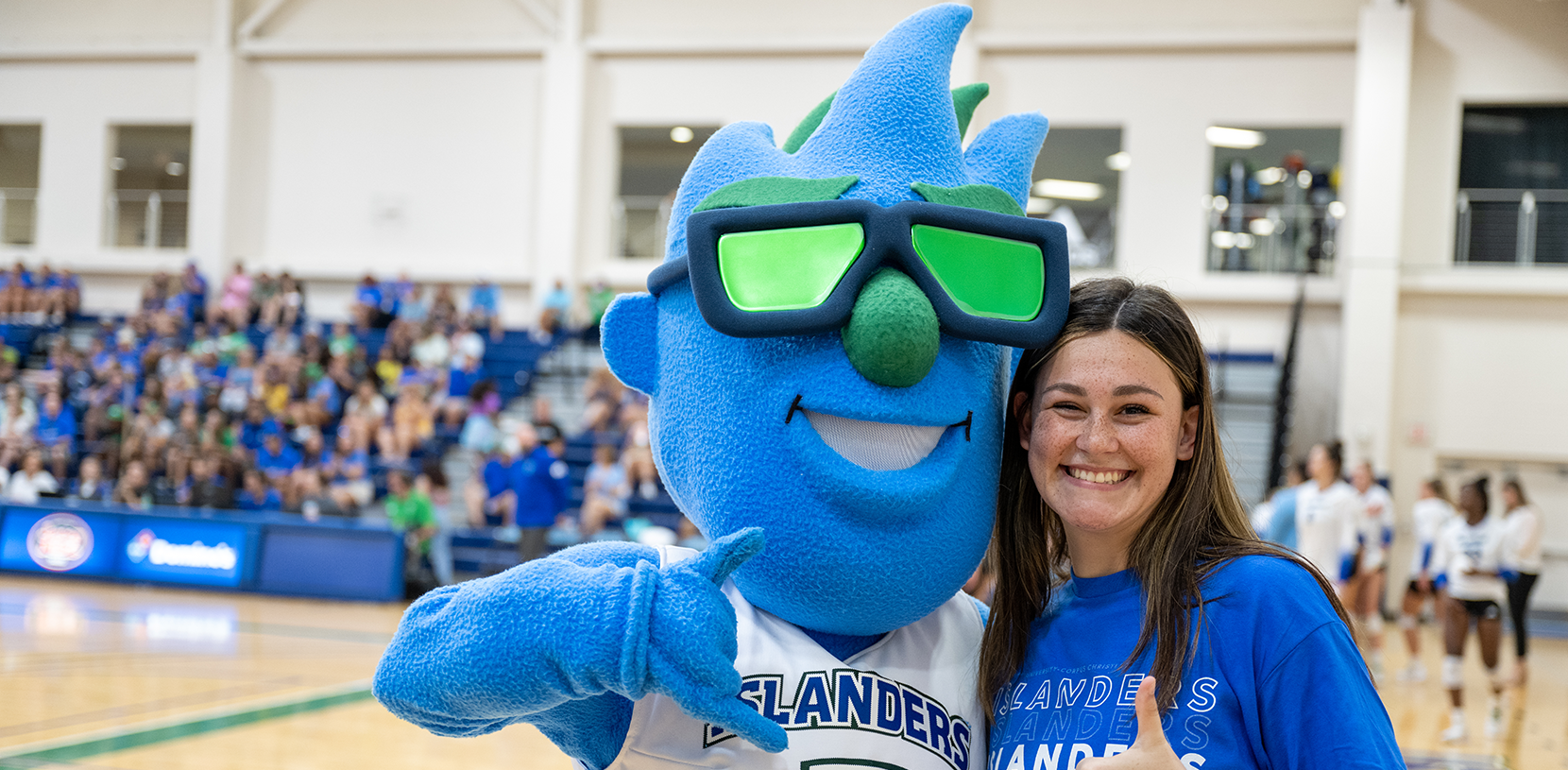 student with a school mascot